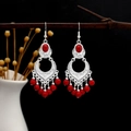 Detail of bohemian silver earrings with red stone inlay and tassels on a branch - Red Silver (E3489)