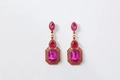 Detailed view of rose red gemstone drop earrings with a vintage gold alloy base - Rose Red