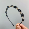 Dettaglio di un cerchietto di lusso con cristalli neri sfaccettati e strass in oro - Cristallo Nero (W24)