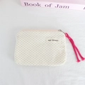 Detail of cream canvas mini pouch with black polka dots and pink cord zipper pull - Off-White Polka Dot