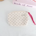 Detail of polka dot heart canvas pouch with a vibrant pink woven cord handle and metal zipper - Off-White with Brown Hearts