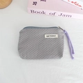 Close-up of grey polka dot canvas coin purse with zipper and purple braided lanyard - Light Grey Polka Dot