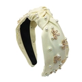 Detalle de diadema de tela amarilla con perlas y lazos azules con borde dorado - Blanco Roto