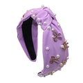 Dettagli del cerchietto in tessuto viola con perle e farfalle smaltate con nodo largo - Viola