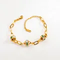Bracciale in acciaio dorato con perline occhio greco in smalto verde e chiusura a moschettone - Catena Serpente Con Ciondolo Ovale a Diamante Pieno e Occhio Cavo Stile (0701 G 04C)
