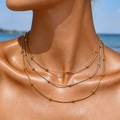 Three-layer layered PVD gold and silver beaded snake chain necklaces on woman's neck - Tricolor Triple Layer Round Bead Chain