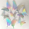 Vue détaillée des papillons 3D ajourés avec finition en papier métallisé arc-en-ciel - Style Coloré C
