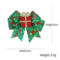 Green Christmas bow hair clip with holiday prints and glitter gift box detail - Christmas Gift Box / Red