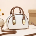 Chic brown and white bowling style mini crossbody bag with gold-tone hardware detail - Mixed White