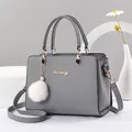 Elegant grey large capacity handbag with plush charm and detachable crossbody strap - 24cm x 13cm x 18cm / Gray
