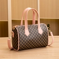 Pink handles and brown cylinder bag with gold pattern and detachable shoulder strap - Pink
