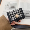 Short houndstooth wallet with gold button closure and black leather piping detail - Black Short Houndstooth