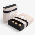 Square pink gift box with black geometric grid, ribbon bow and merci BEAUCOUP label - Roman Space (Wave Pattern)