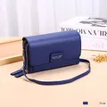 Navy blue cross-body wallet with litchi grain texture and long shoulder strap - Blue
