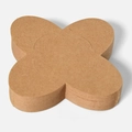 Stack of clover-shaped kraft paper chocolate liners with natural brown wood texture - Kraft Paper Color