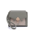 Detail of short leather wallet with heart pattern and gold floral metal clasp closure - Green