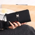 Detail of black Saffiano leather long wallet with silver heart buckle and hand strap - Black