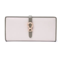 Close-up of contrast color wallet with cross-grain texture and golden bow buckle - Beige
