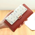 Long portefeuille en similicuir brique et crème avec imprimé floral et fermoir doré - Couleur caramel