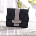 Short black trifold wallet with gray tab and floral geometric embossed pattern - Black