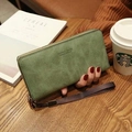 Women's long zip-around wallet in light green matte leather with wrist strap - Grass Green