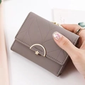Gray bi-fold wallet for women with scalloped stitching and gold flower clasp - Gray