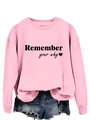 Dettaglio della stampa 'Remember your why' su felpa rosa a girocollo da donna - Felpa Rosa (Carattere Nero)