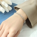 Minimalist silver interlocking circle bracelet in titanium steel shown on wrist - Silver (Z008-Steel Color Bracelet)