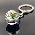 Hummingbird crystal glass ball keychain with silver metal ring on reflective surface - Black Vine Scroll Hummingbird (XSWX2271-9)