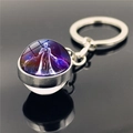 Double-sided glass ball keychain featuring the Virgo constellation in purple and blue - Virgo