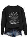 Detail of floral book graphic and text on a black long sleeve crewneck sweatshirt - S / Black (White Letters)