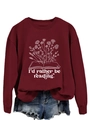 Detail of burgundy sweatshirt featuring floral book print and I'd rather be reading text - S / Wine Red (White Font)