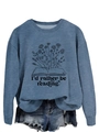 Detail of the 'I'd rather be reading' floral graphic print on a denim blue sweatshirt - S / Blue (Black Font)