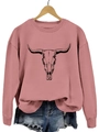 Détail du sweat-shirt rose ample avec imprimé tête de taureau sur un cintre - Or rose
