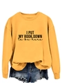 Detail of yellow sweatshirt featuring I PUT MY BOOK DOWN print and drop shoulder design - S / Yellow (Black Font)