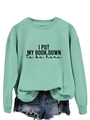 Detail of mint green sweatshirt featuring I PUT MY BOOK DOWN print and ribbed crewneck - S / Light Green (Black Text)