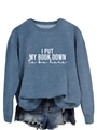 Close-up of 'I PUT MY BOOK DOWN' print on blue long sleeve sweatshirt and denim shorts - S / Blue (White Font)
