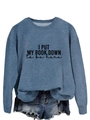 Detail of blue crewneck sweatshirt with 'I PUT MY BOOK DOWN to be here' text and denim shorts - S / Blue (Black Font)