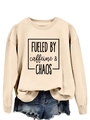 Close-up of Apricot sweatshirt with Fueled by Caffeine and Chaos print and denim shorts - S / Sand (Black Font)