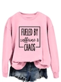 Detail of pink crewneck sweatshirt with 'FUELED BY caffeine chaos' black print text - S / Pink (Black Text)