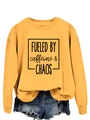 Close-up of mustard yellow sweatshirt with black FUELED BY caffeine & CHAOS print detail - S / Yellow (Black Font)