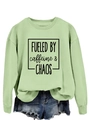 Flat lay of pale green sweatshirt with Fueled by Caffeine and Chaos print and denim shorts - S / Olive Green (Black Font)