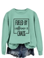 Detail of mint green crewneck sweatshirt with Fueled by Caffeine and Chaos graphic print - S / Light Green (Black Text)