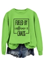 Flat lay of a green crew neck sweatshirt with 'FUELED BY caffeine & CHAOS' print and denim shorts - S / Neon Green (Black Font)