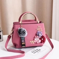 Pink crossbody bag with 3D floral decoration, gold metal handle and grey fur pompom charm - Pink