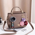 Brown faux leather crossbody bag featuring 3D floral accents and a metal handle - Khaki