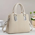 Close-up of beige chevron woven tote bag with silver hardware and leather handles - 30/13/23 / Off-white