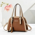 Retro brown canvas tote bag with beige leather trim and beaded tassel on white stand - Khaki/Earth Yellow