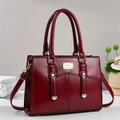 Elegant wine red PU leather handbag with gold hardware and adjustable shoulder strap - Red