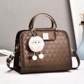 Brown patent leather handbag with triangle texture and metallic gold circular handle - Coffee